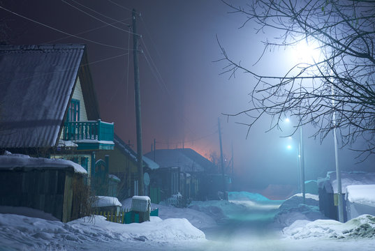 Night shot of country street under snow in winter season