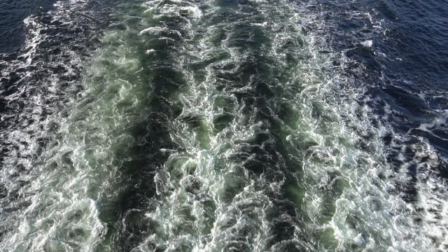 Back view of the sea washing from a cruise ship, Slow motion