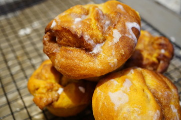 Pumpkin cinnamon rolls freshly baked in muffin tins