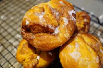 Pumpkin cinnamon rolls freshly baked in muffin tins