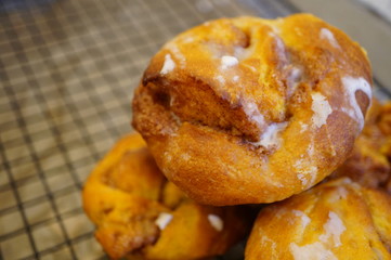 Pumpkin cinnamon rolls freshly baked in muffin tins