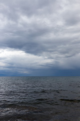 Fototapeta premium cloudy weather on the sea as background