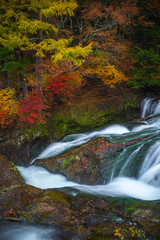 Vertical shot of long exposure Ryuzu waterfall in autumn Nikko Touchigi Japan