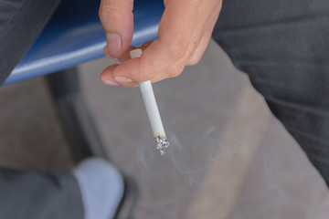 man smoking a cigarette