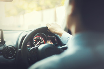 Close-up of Young man driving on the road - vintage tone