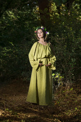 Naklejka premium Fantasy Fairy Tale Forest , young woman posing as nymph