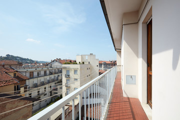 Empty, long balcony in a sunny day in Italy