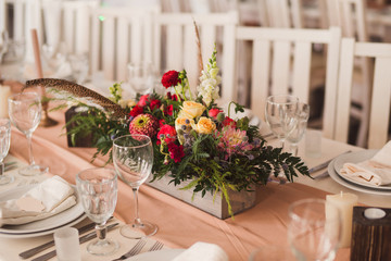 floral decoration on the table at wedding reception