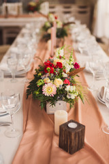 floral decoration on the table at wedding reception
