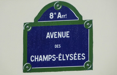 Painted street sign on a house wall in Paris - Avenue des Champs Elyseess