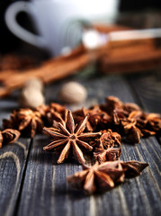 Heap of anise stars on wooden table