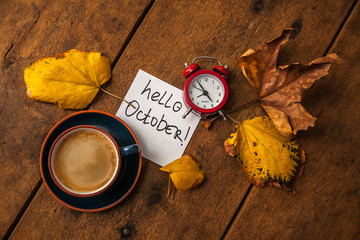 coffee and clock on wooden table - obrazy, fototapety, plakaty