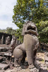 Fototapeta na wymiar Lion stone sculpture in Angkor Thom. Angkor Wat complex. Siem Reap, Cambodia. UNESCO World Heritage Site.