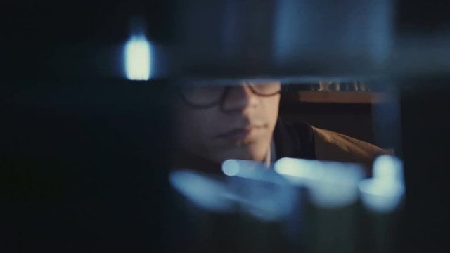 Secret agent looking for documents in the library