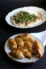 Pâté with tuna and parsley, and homemade pastry. Black background, selective focus. 