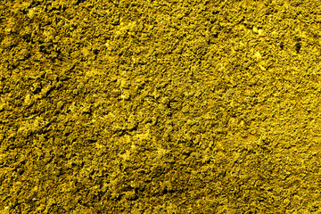 Golden revetment wall putty macro texture background