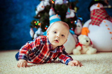 Baby near the Christmas tree