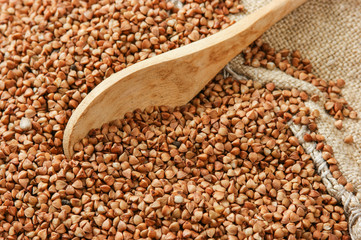 buckwheat groats and wooden spoon