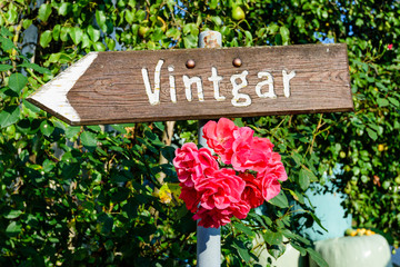 A pointer to Vintgar gorge on a wooden Board, Slovenia. Vintgar gorge is a popular tourist destination in Slovenia.