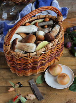 Basket with boletuses on a table.