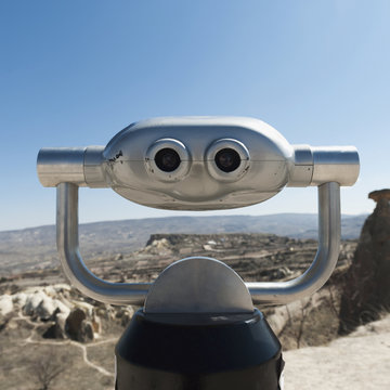 Binoculars with a view of the landscape and a blue sky;Urgup nevsehir turkey