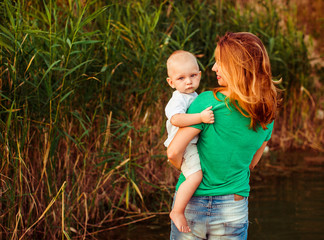 Little boy on mother's arms