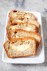 Sliced banana bread with cream cheese