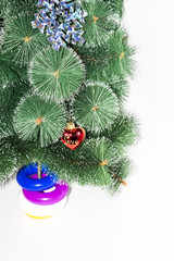 Christmas tree on which hangs a red toy with the word love on a white background