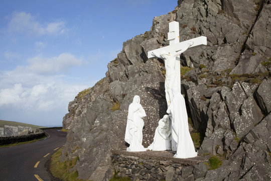 White religious figures standing on a rock beside the road at slea head near dunquin on the dingle peninsula;County kerry ireland