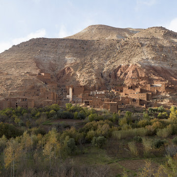 Buildings at the foot of a mountain