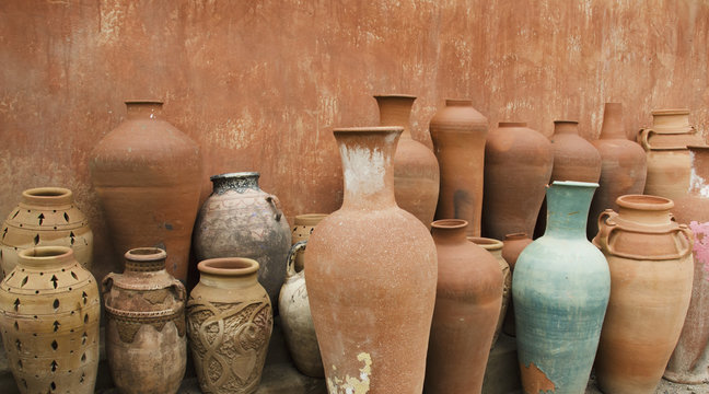 Variety of clay pots against a wall;Morocco