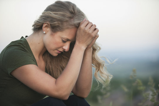 A woman praying;Arvada colorado united states of america