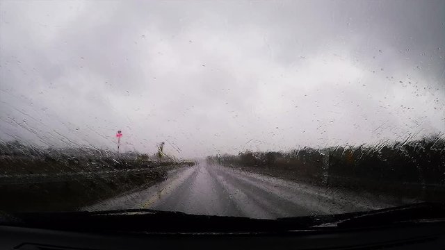 Driving through Ohio, POV drive, windshield wipers in the rain.