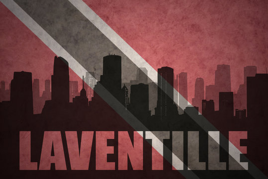 abstract silhouette of the city with text Laventille at the vintage trinidad and tobago flag