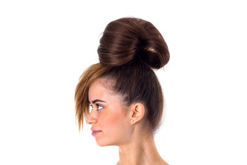 Woman with hair in a bun standinf sidewise
