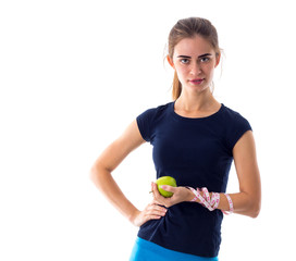 Woman with centimeter holding an apple 