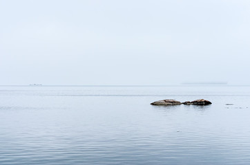 Lonely rocks on a foggy day in the St. Lawrence River Thousand Islands Area