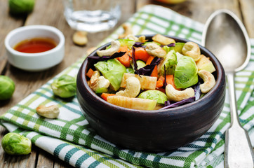 Brussels sprouts red cabbage carrot cashew apple salad with mapl