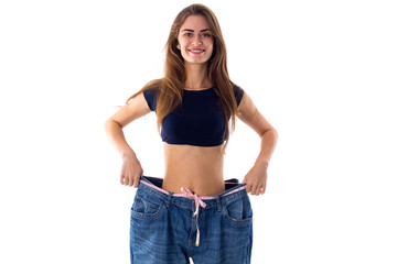 Woman wearing jeans of much bigger size