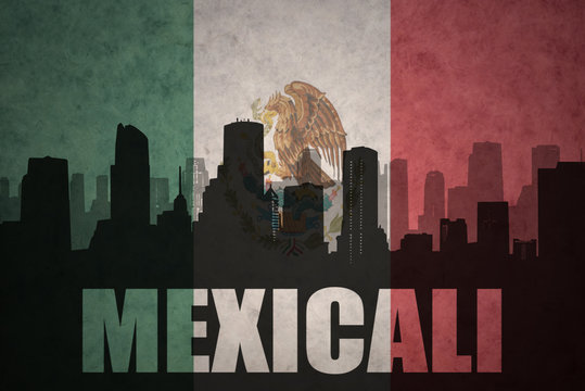 abstract silhouette of the city with text Mexicali at the vintage mexican flag