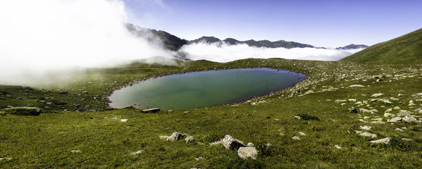 Panoramic view of a glacial lake on top of the foggy Kackar mountains
