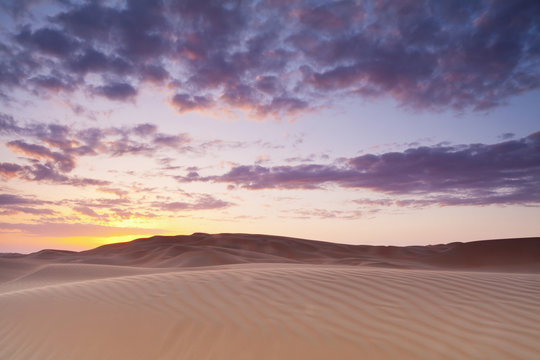 Sunset Over The Sand Dunes; Liwa Oasis, Abu Dhabi, United Arab Emirates