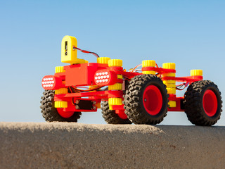 Radio Controlled car, assembled from kids building kit. Produced buy 3d printing. Electric robot.