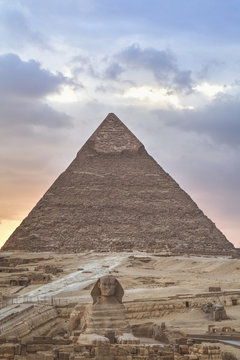 Sunset, Sphinx (foreground), The Pyramid of Chephren (background), The Pyramids of Giza; Giza, Egypt
