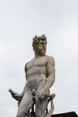 Fototapeta na wymiar Famous Fountain of Neptune on Piazza della Signoria in Florence, Italy 