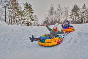Fototapeta na wymiar Happy children on a winter sleigh ride