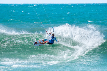 Amazing kite surfing at Philippines. Processional instructor surfing in ocean waives