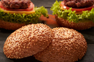 Two hamburger on a wooden table