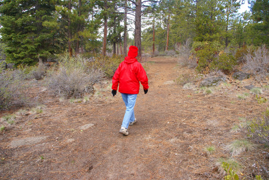 Woman Hiker In Red Parka