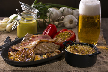 Dish with rustic snacks on rough canvas